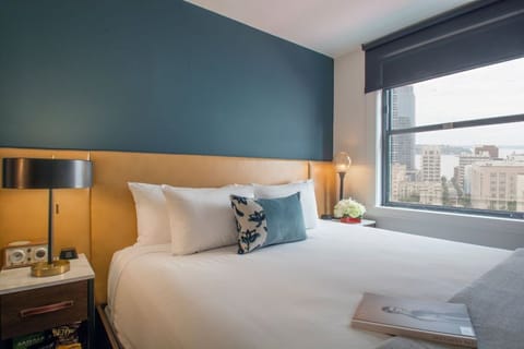 A peaceful retreat with a plush bed, soft pillows, and a serene color palette for restful nights