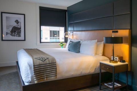 Soft lighting and a plush bed create a haven of tranquility with a touch of modern flair.