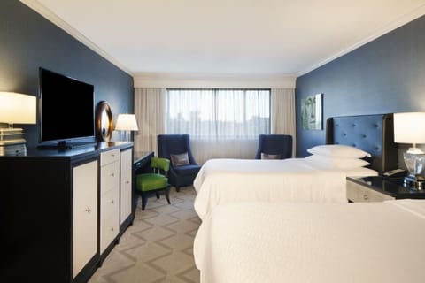 Settle in comfortably with two plush beds and calm lighting.