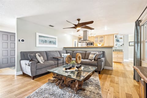 Sink into the plush sectional for movie nights or relaxing afternoons in this inviting and beautifully styled living room.