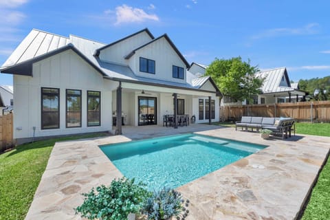 Sit at the table, float in the pool, or lounge on the outside sofa