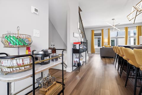 Complementary breakfast bar on top: with assorted goodies and pancake/waffle mix to make waffles with syrup and chocolate chips for the kiddos. Adult bar utensils and cocktail guide on the bottom.
