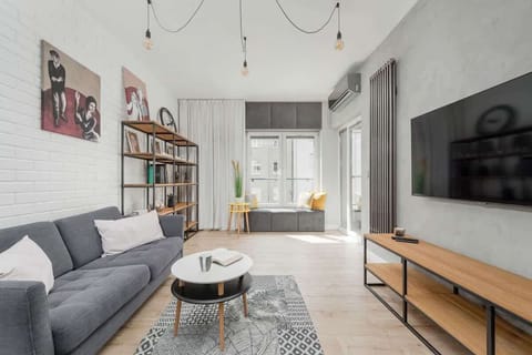 Living room with a comfortable sofa and TV. 