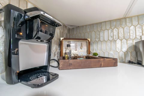 Keurig coffee maker and coffee pods provided.