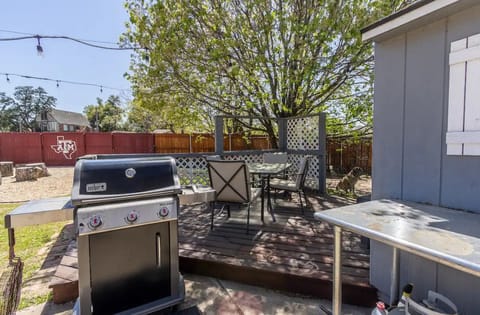 Backyard grill (propane) and patio by the fire pit area 
