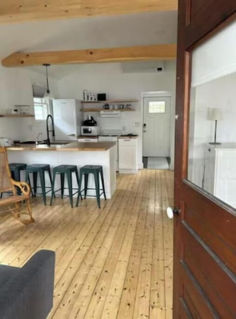 Inside front door off sun porch- living room to left 