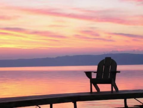 Sunrise chair on dock associated with cottage