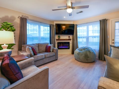 Large Roku TV, fireplace, recliner, loveseat, queen sleeper sofa, beanbag.