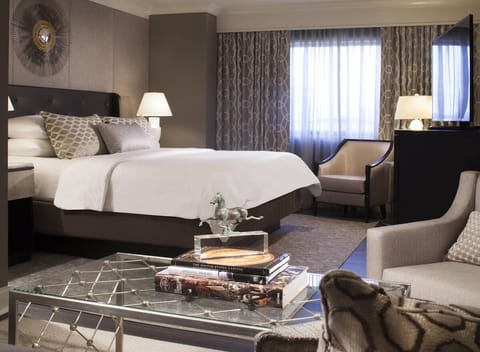 Unwind in plush bedding and soft light after adventures.
