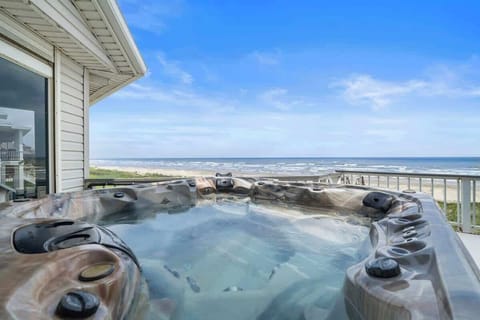 Relax in the Jacuzzi overlooking the ocean and soak in the refreshing sea breeze