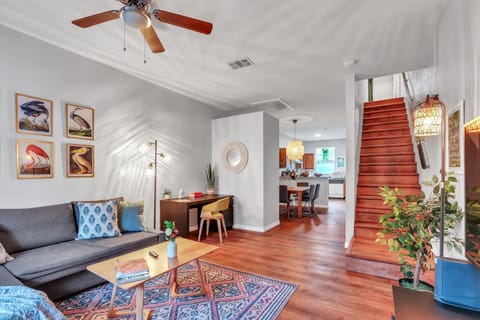 Work and play in style. This bright living area features a dedicated desk and ergonomic chair for your remote needs, perfectly positioned alongside our comfortable sectional and large flat-screen TV.