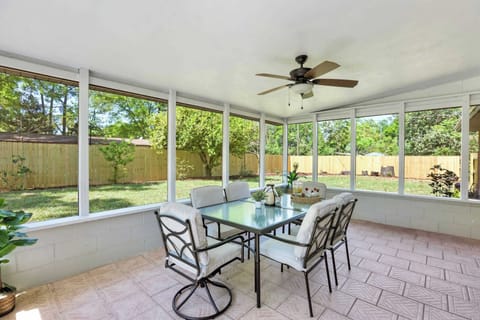 Discover the inviting exterior of our fully remodeled brick home, featuring a large screened porch and spacious backyard.
