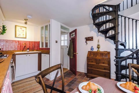 From the front entrance, it opens into the kitchen and dining space. 