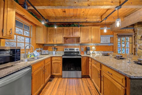 Gourmet kitchen opens to the living room and dining room with all the tools