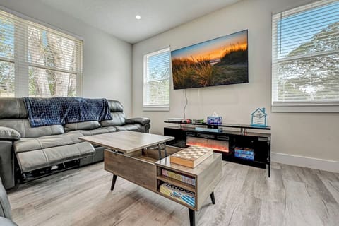 Table opens for laptop workspace, plenty of board games in table and entertainment center, xbox with games and movies