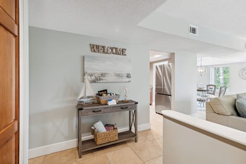 The open layout leads into a bright kitchen and dining area, creating a warm and welcoming first impression.