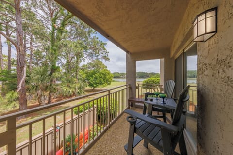 Covered balcony with the peaceful waterway and golf course view