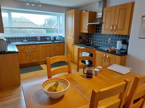 Fully equipped fitted kitchen with microwave and coffee machine