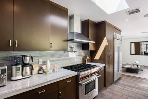 Cook up culinary delights on the modern stove and appliances, ensuring a seamless cooking experience.