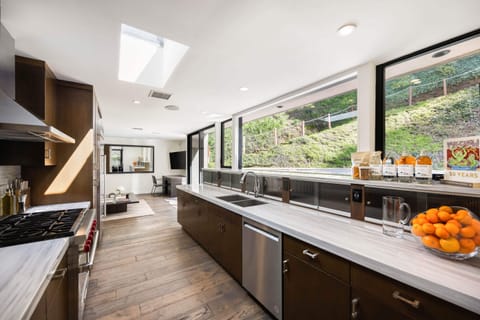 Brighten your culinary endeavors with natural light streaming through the kitchen windows, creating an inspiring atmosphere.