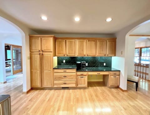 Kitchen with breakfast nook/office to left and large dining room on right