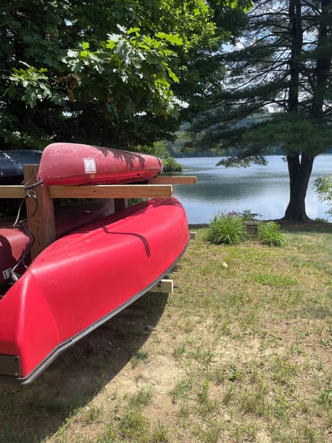 Canoe and kayak ready to launch at the beach and awaiting guests.