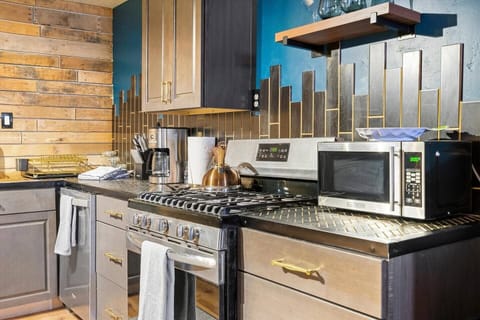 Kitchen has a gas stove with amenities that allow for a quick meal