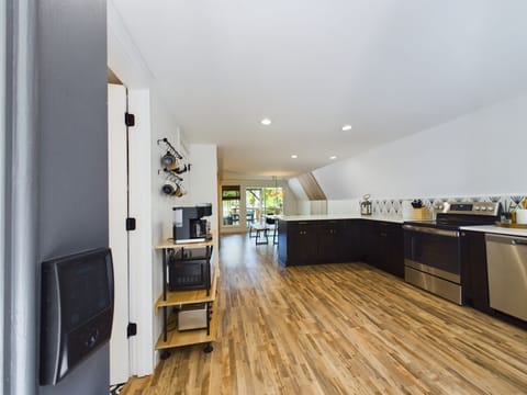 The main level of the A Frame is an open space design between the kitchen, dining and living areas.