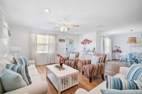 Welcome to the front living room — perfect for relaxing and catching up. Looking for the big screen? Don’t worry, the large TV is in the second living