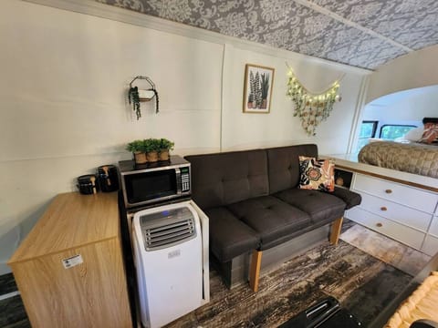 Sitting area with portable A/C unit.