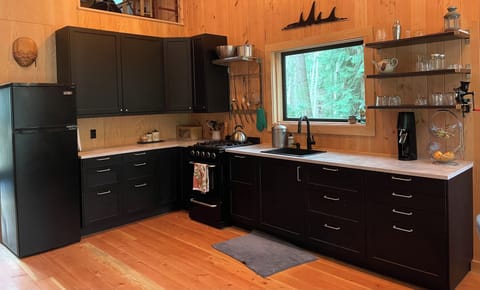 Full kitchen with new appliances, pots, pans, baking supplies etc.