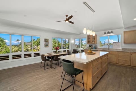 Fully Stocked kitchen with bar seating