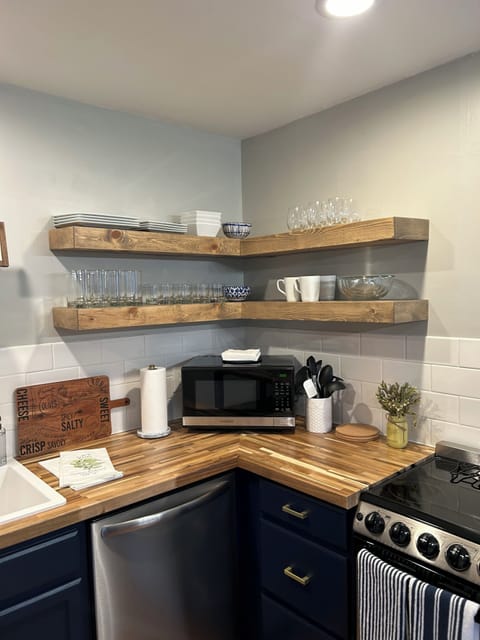 Newly remodeled kitchen with custom floating shelves
