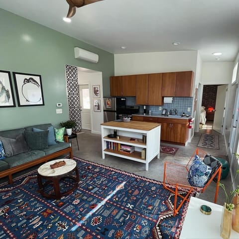 Living room with full kitchen