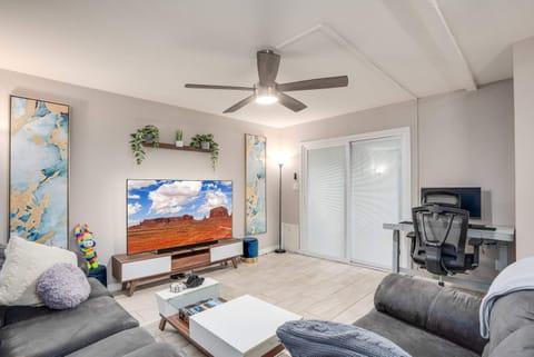Comfortable living room seating + set up work station ready for our busy travelers!