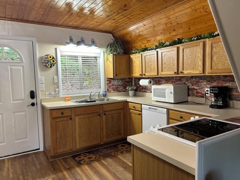 Equipped kitchen with microwave, coffeemaker, Keurig and ice maker.