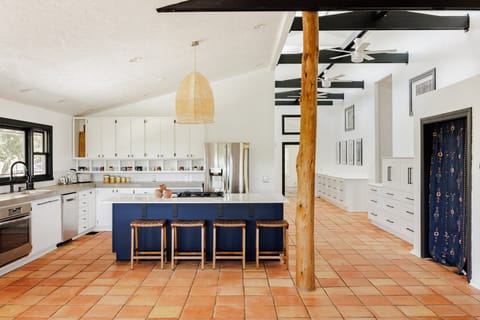 Open kitchen showcases stylish stainless-steel appliances