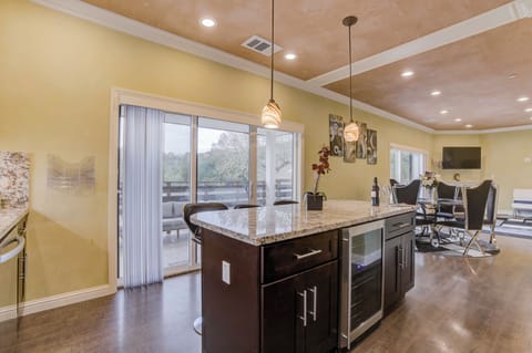 Upstairs Kitchen with Kitchen Island & Stainless Steel Appliances