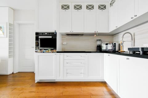 Culinary excellence awaits in our state-of-the-art kitchen, featuring high-end appliances and sleek design for the discerning chef.