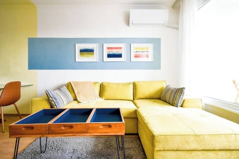 You’ll unwind in this bright, cozy living room, the perfect spot to relax after a day of exploring. Curl up on the plush sofa and enjoy the serene atmosphere.