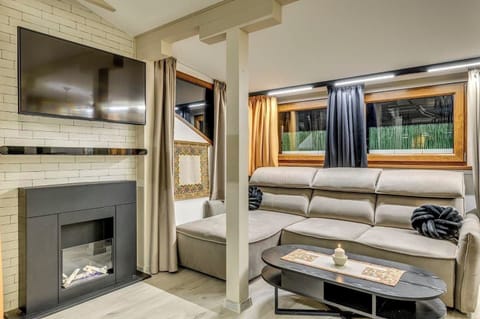 Relax in this spacious living area – perfect for unwinding after exploring Sofia! 🌆 Book Now for Your Cozy Getaway!