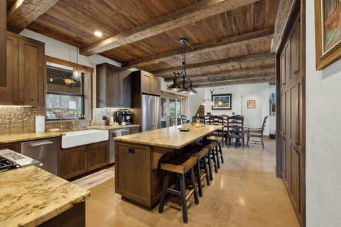 Updated full kitchen with island seating for five.