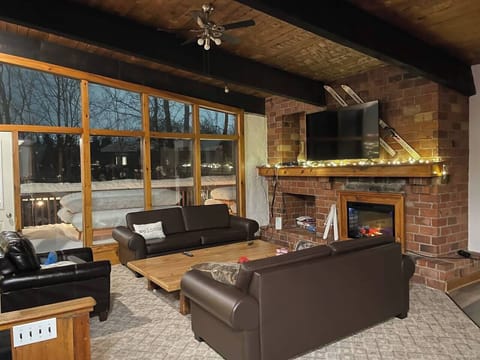 Living Room (upper level) with access to Balcony and BBQ