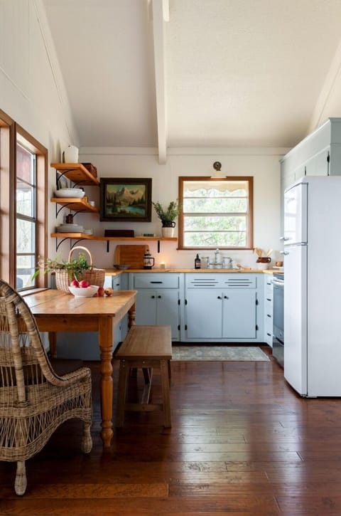 Indoor dining table next to the kitchen. Additional seating available