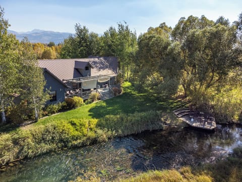 Main house, back porch, backyard, and river-front porch
