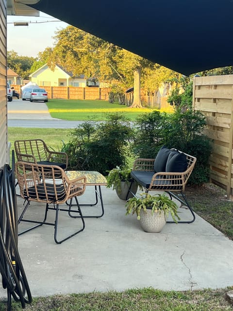 Exterior Front side patio w/ shade sail cover