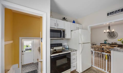 This kitchen  has everything you need to cook a large meal. Plus:  Crock pot, rice cooker, sm. air fryer, Electric blender, juice maker, Electric can opener and more. Safety gate to protect the little ones.