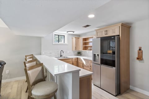 Lower level kitchenette for extra refrigerator space and seating.