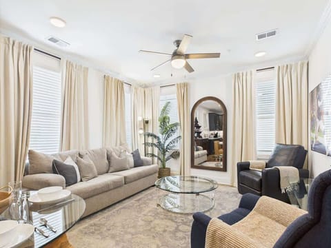 A warm and inviting living room features comfortable furnishings and decor to make you feel right at home. A Smart TV provides entertainment. The living room sofa converts into a Queen-size bed for extra guests.