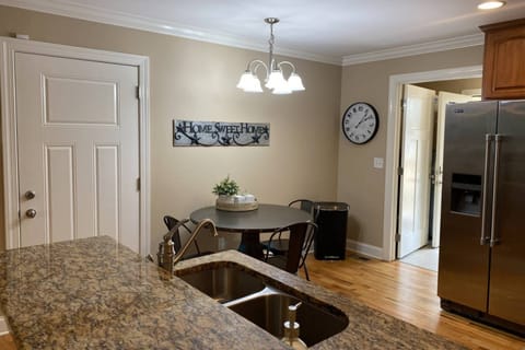 Dining table in "Tennessee Delight 4" seats 4, with additional 3 stools at the kitchen island